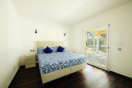 Bedroom with wooden floor in new built sea view luxury villa in Sol de Mallorca