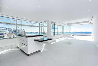 Open plan living room and kitchen in luxury aparment Puerto Portals